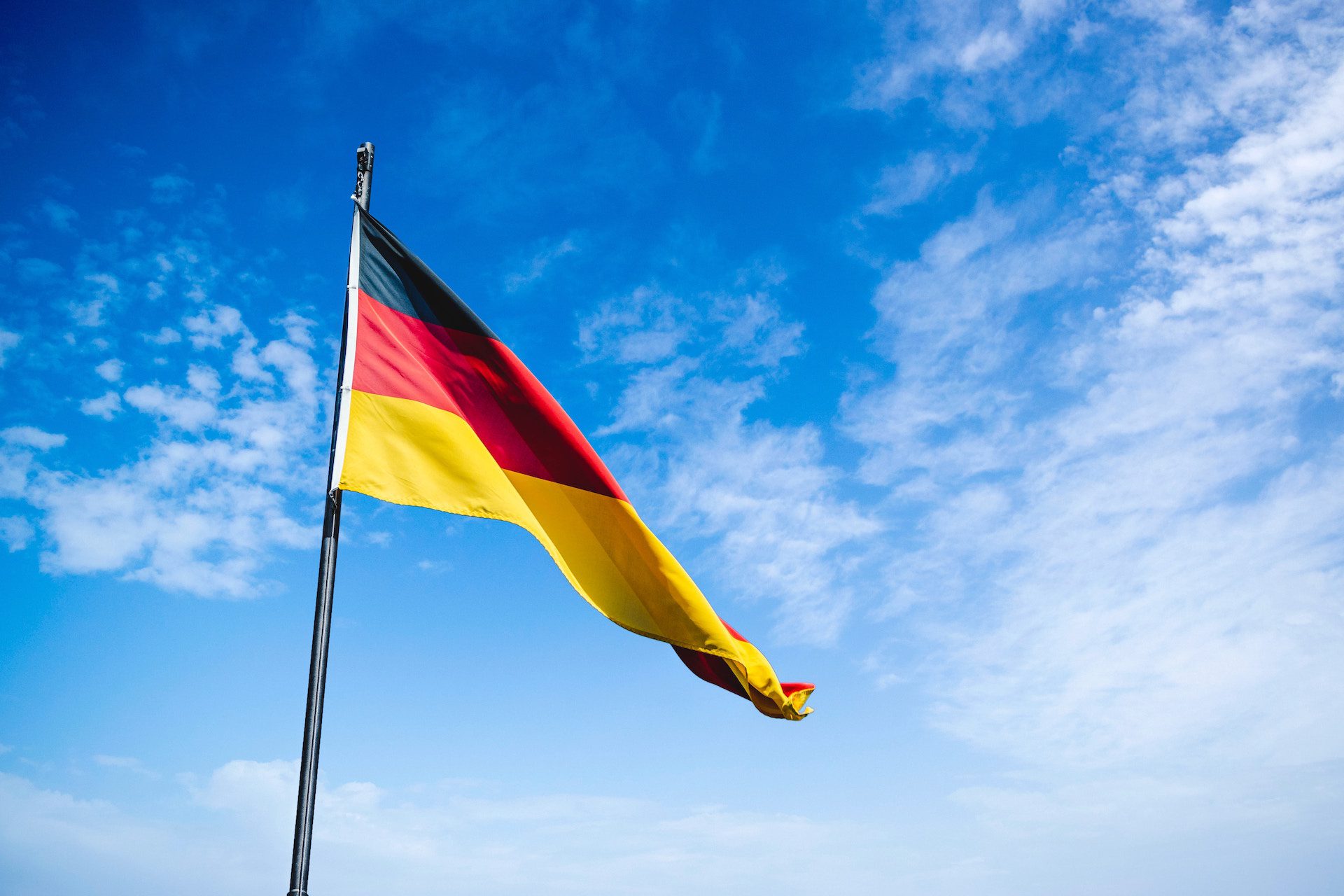 Germany flag against a sky blue background