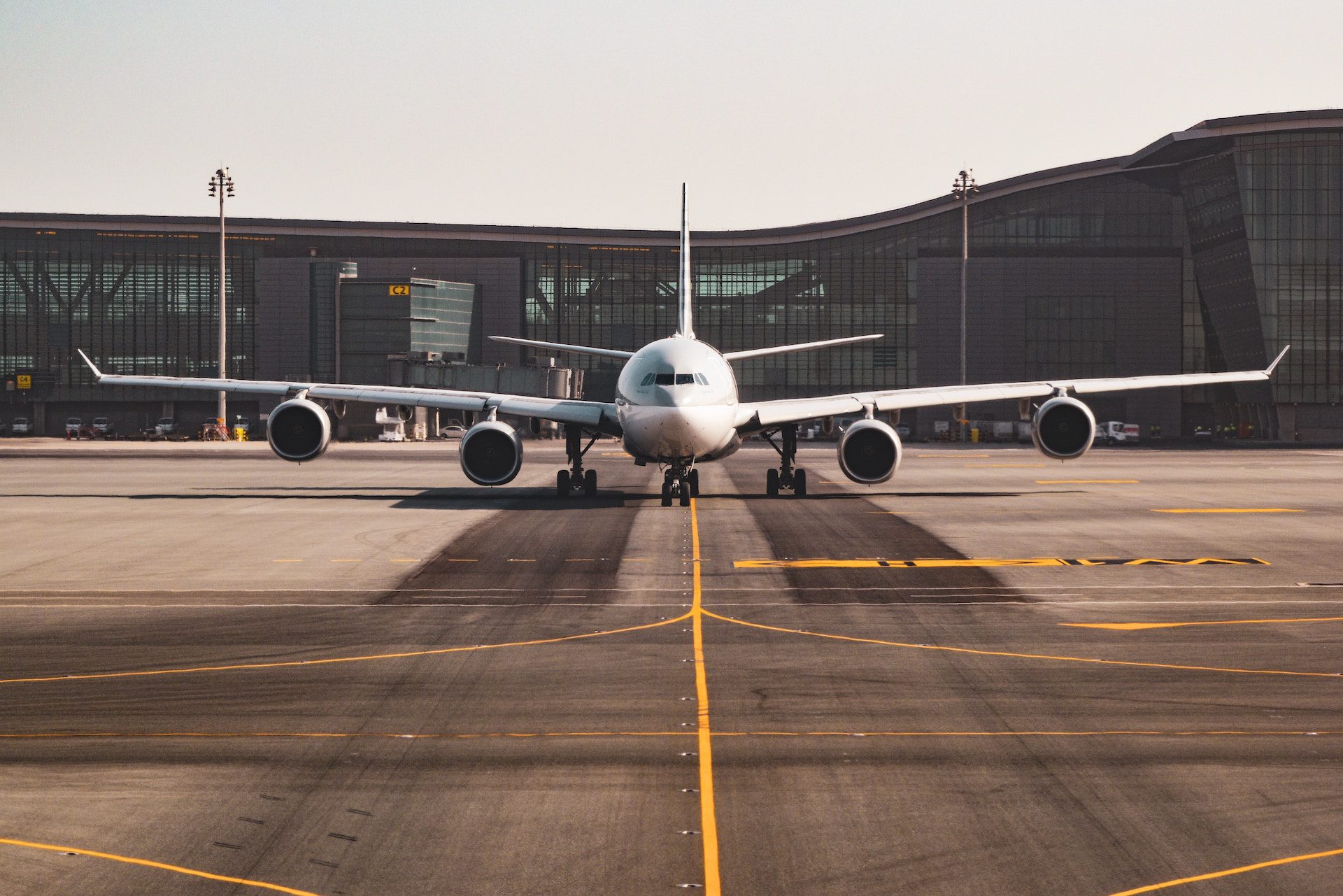 aeroplane on the runway with airport in the background