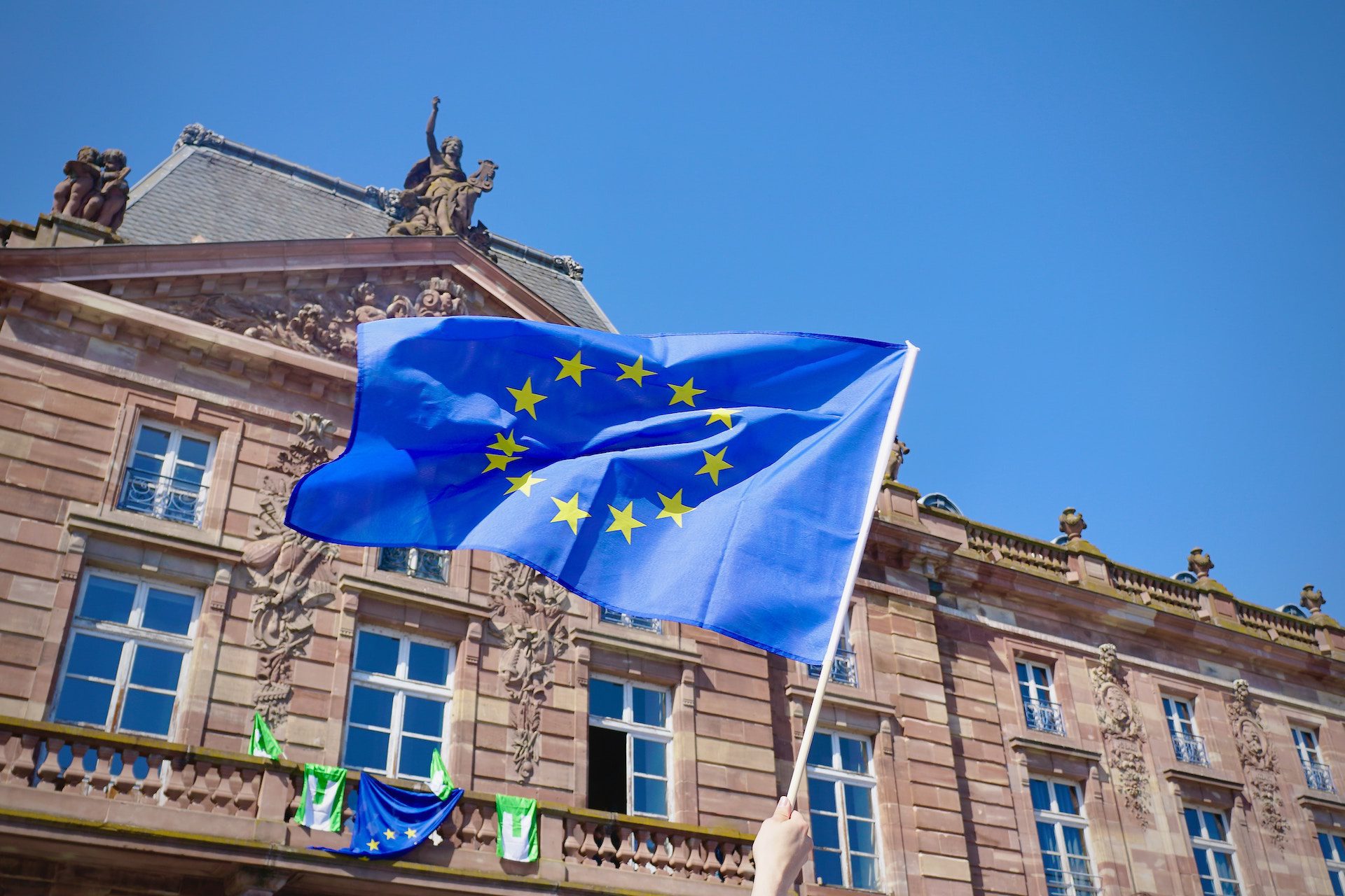 European flag attached to front of a building